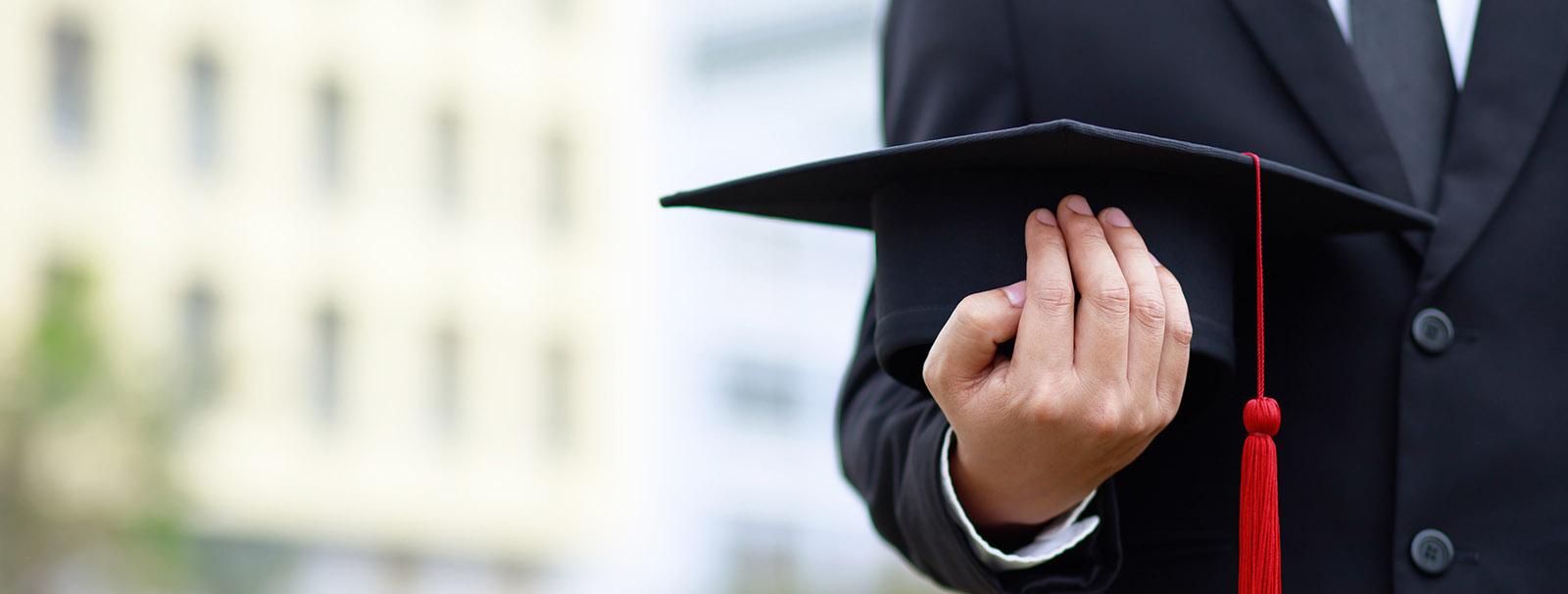 student with graduates hat